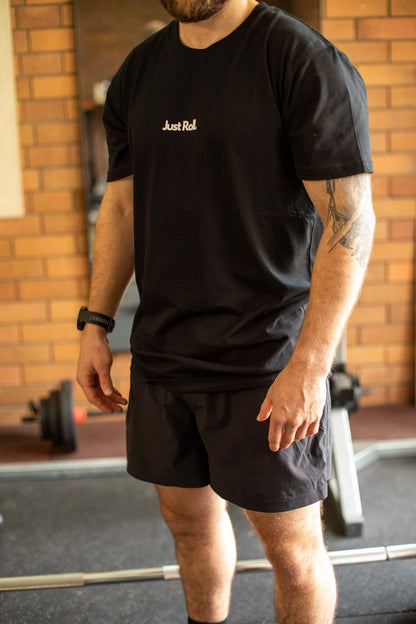 Athlete in gym in black and white brazilian jiujitsu t-shirt