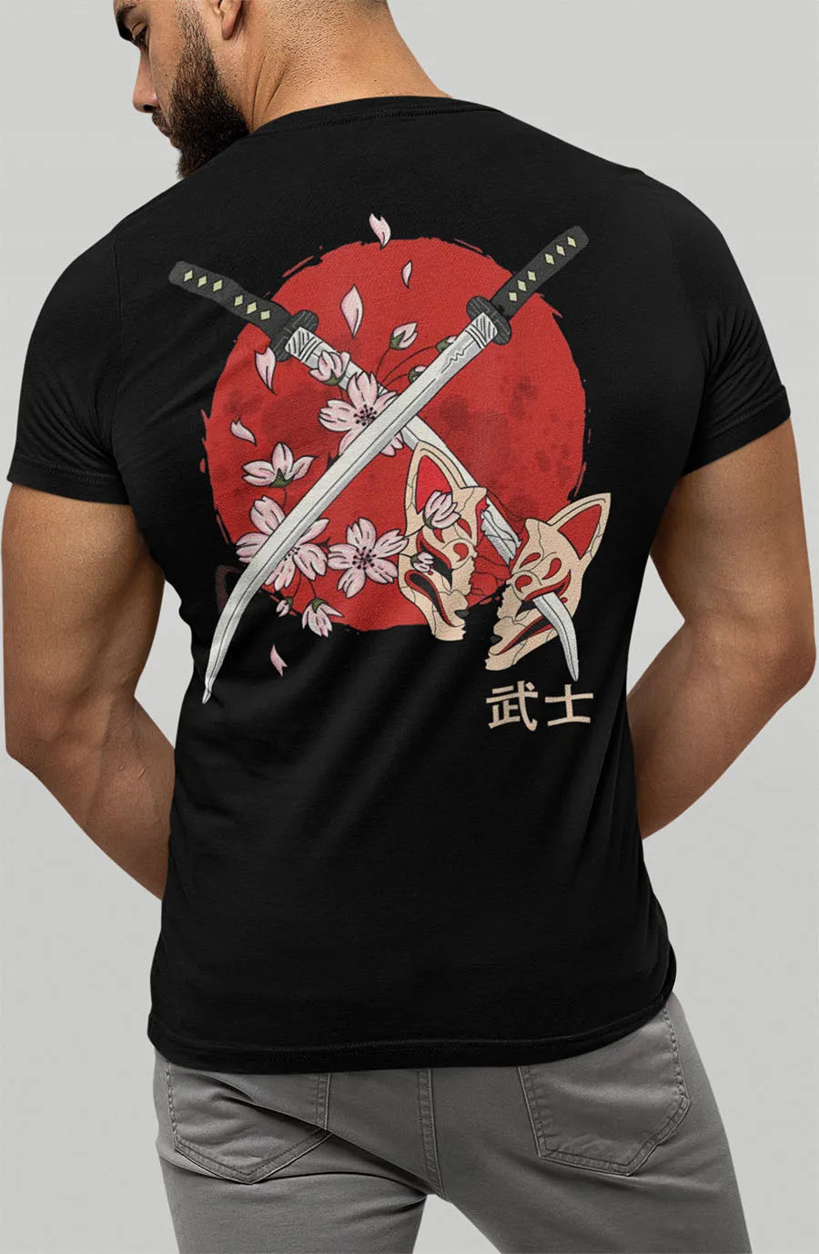 Samurai swords and cherry blossoms with a broken mask. Red lettering on the chest. Men's black t-shirt.