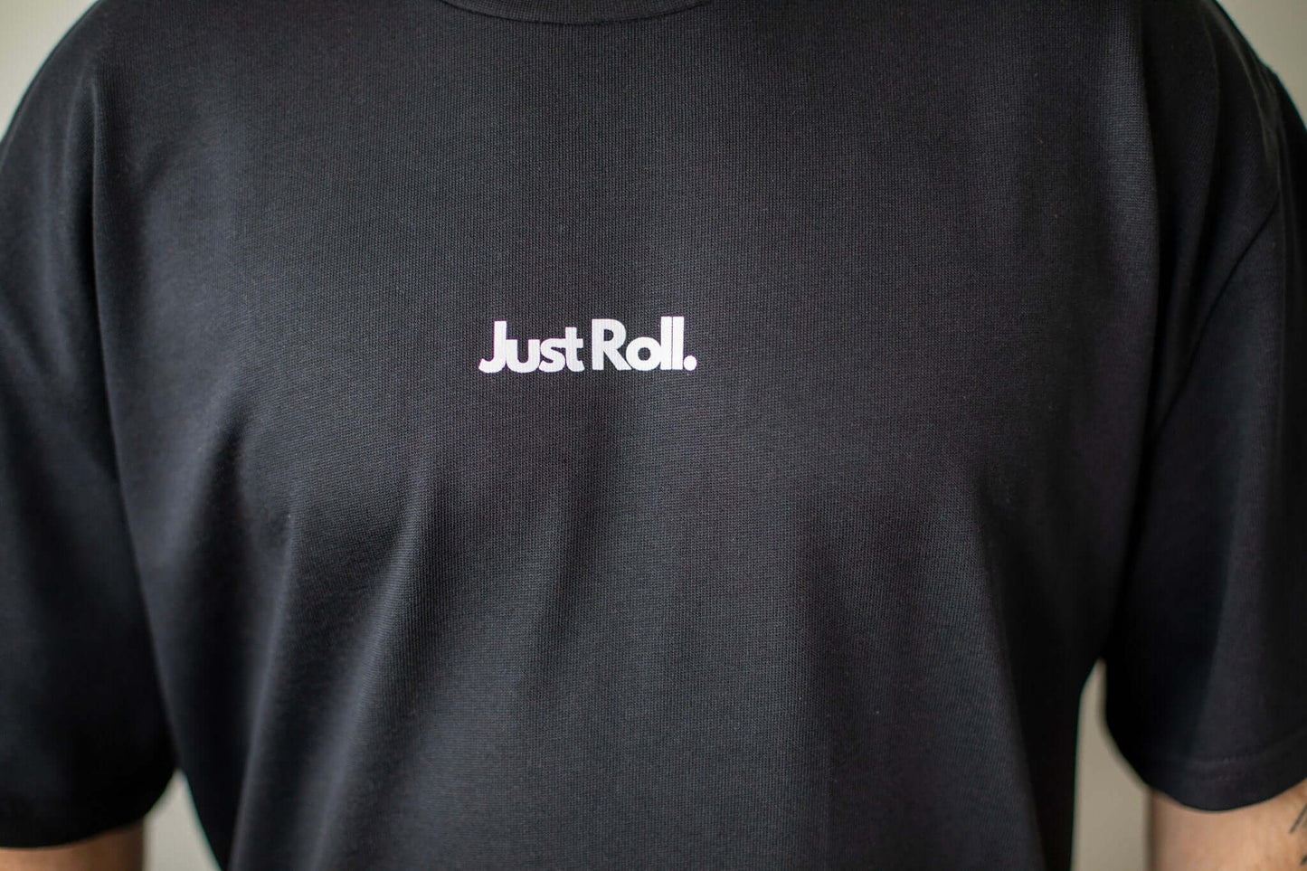 Close up of Just Roll black and white t-shirt