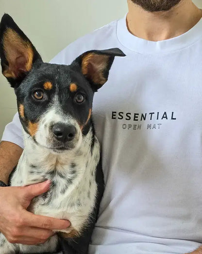 Man and dog in white and black brazilian jiujitsu t-shirt